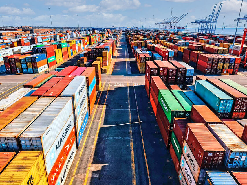 stacked shipping containers at the port of baltimore